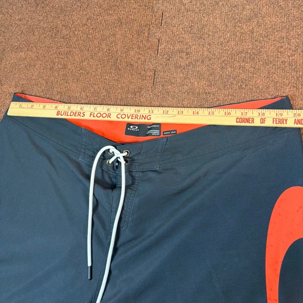 A+ Oakley Performance Fit Board Shorts Mens 38 Black Orange Ellipse Swim Trunks